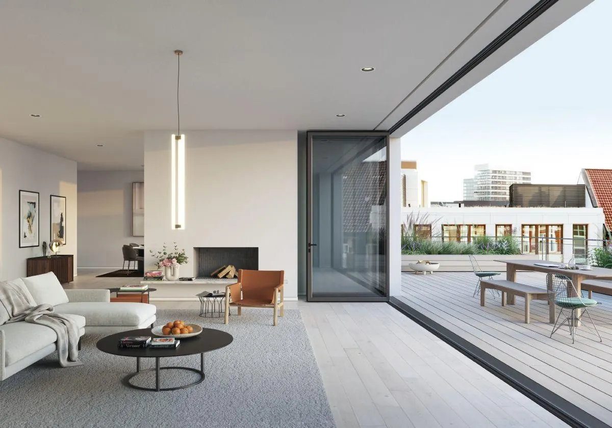 Sch&uuml;co AS FD 75 bifold doors folded open onto a decked terrace