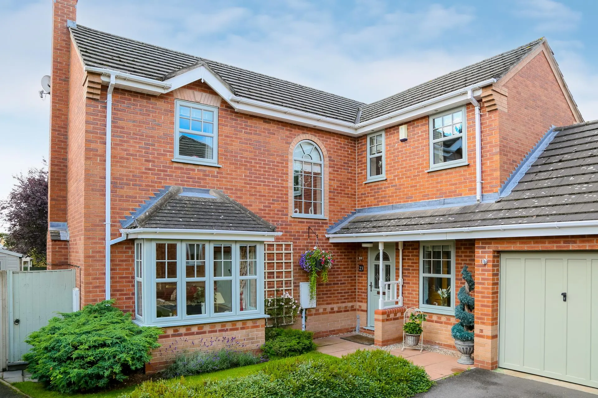 Agate Grey uPVC casement windows across a full house facade