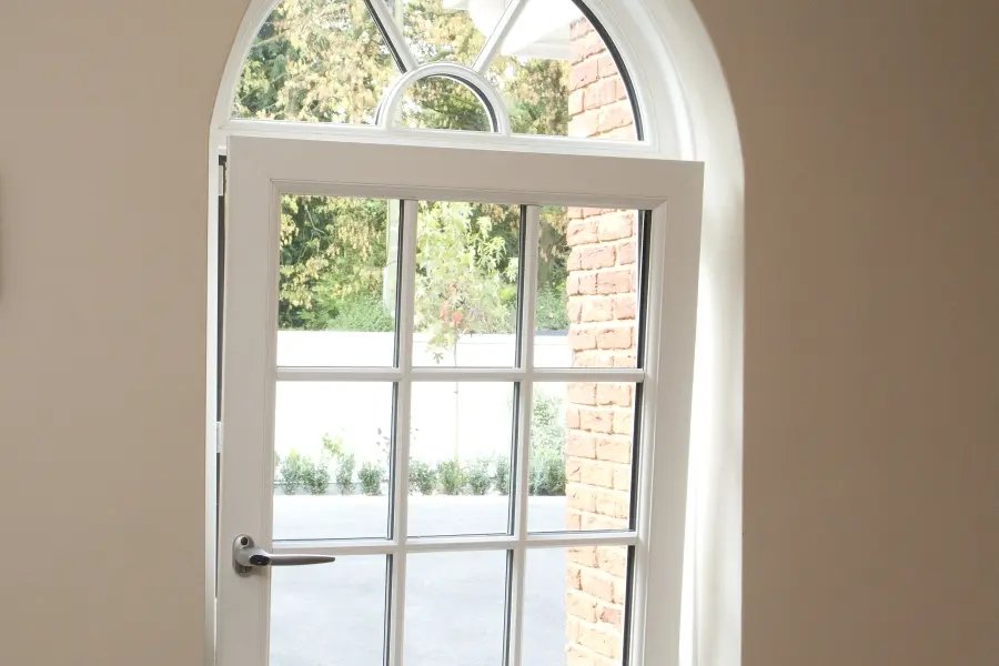 White uPVC tilt and turn window turned fully inward for cleaning