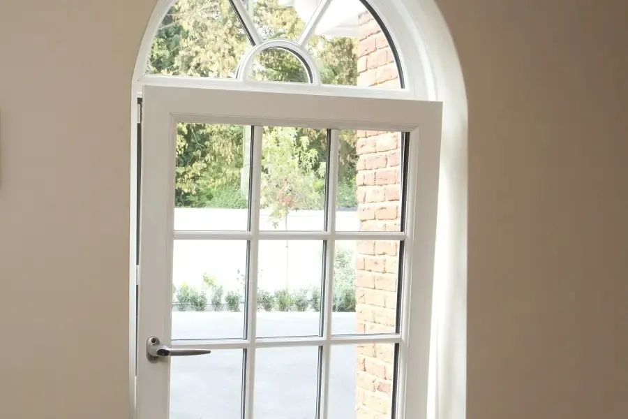White uPVC tilt and turn window turned fully inward for cleaning